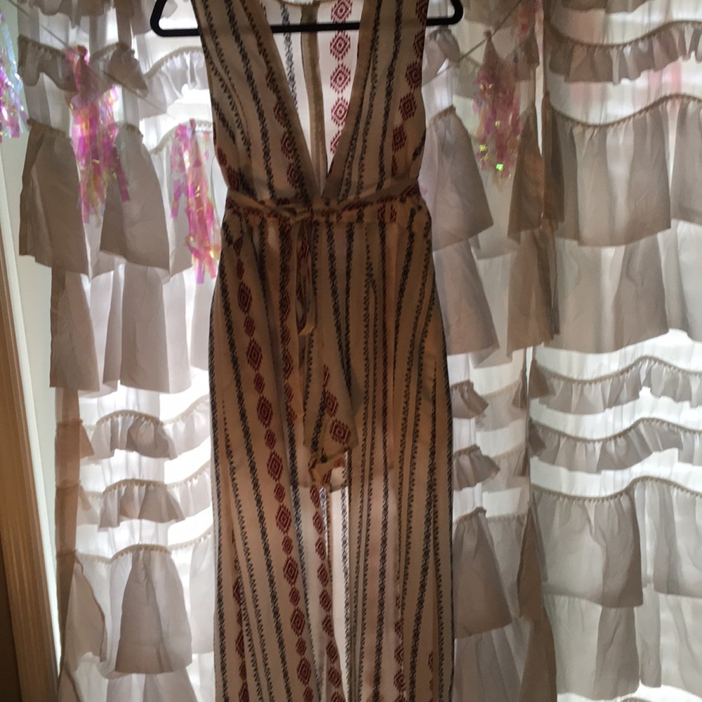 Size Large. Aztec print romper with train